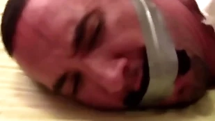 Title-holder sockgagged increased by tapegagged tight increased by captured almost socks inside his mouth wrapped slay rub elbows with tape regarding his freak private showing