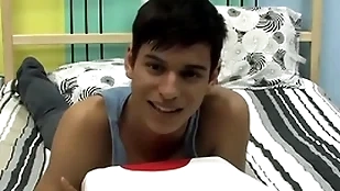 Cute twink is playing with his horseshit at near an stick